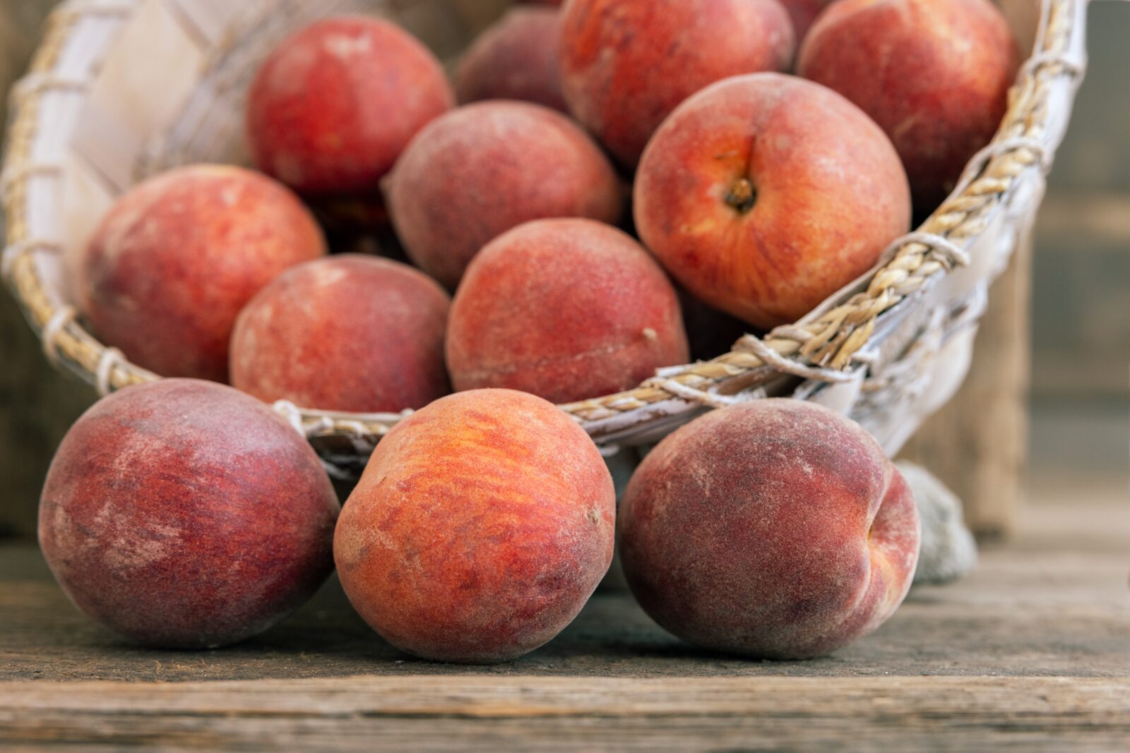Fresh sun-ripened peaches in a basket from Farm on Central